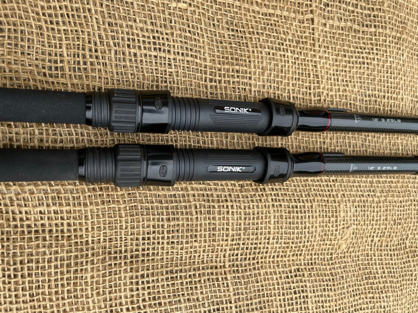 2 x Sonik Vader X RS 3.25lb T/C Carp Fishing Rods + JRC Defender 42” Landing Net.