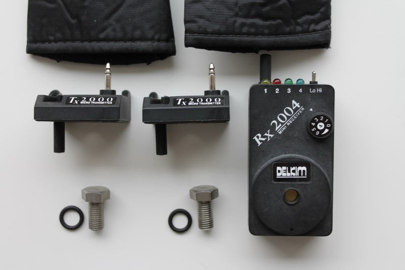 2 x Delkim TX 2000 Micro Transmitters, RX 2004 Mini Receiver And Soft Cases. Old School 1990s.